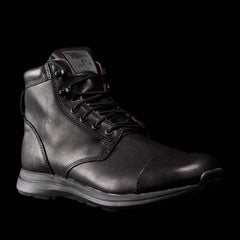GORUCK durable black leather rucking boot with rugged sole on black background