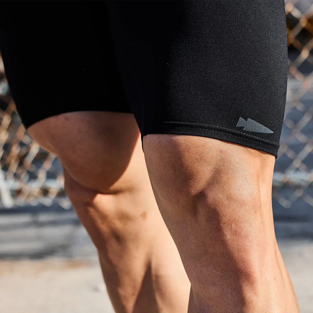 goruck.mompression shorts for rucking, close-up on muscular legs outdoors