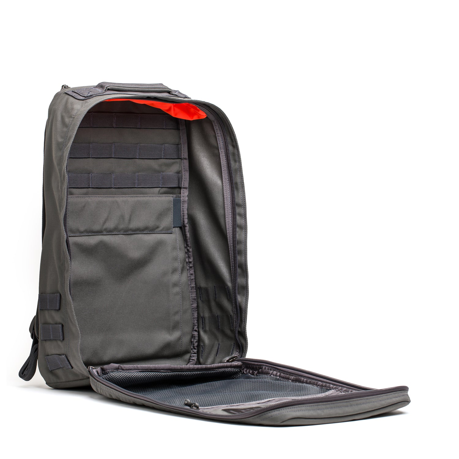 The GR1 USA - Cordura rucksack in gray is shown with its front compartment unzipped, revealing inner pockets and vibrant orange lining—an everyday carry backpack built to Special Forces grade standards.