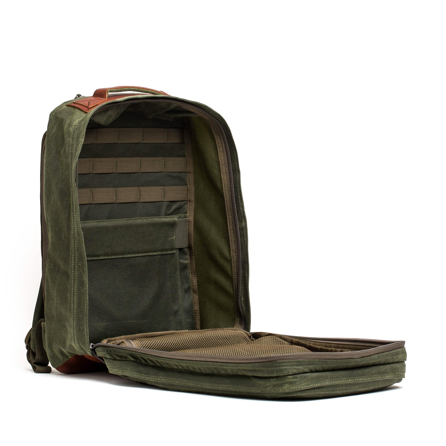 GORUCK olive waxed canvas backpack with brown leather accents, open to show interior pockets and MOLLE webbing
