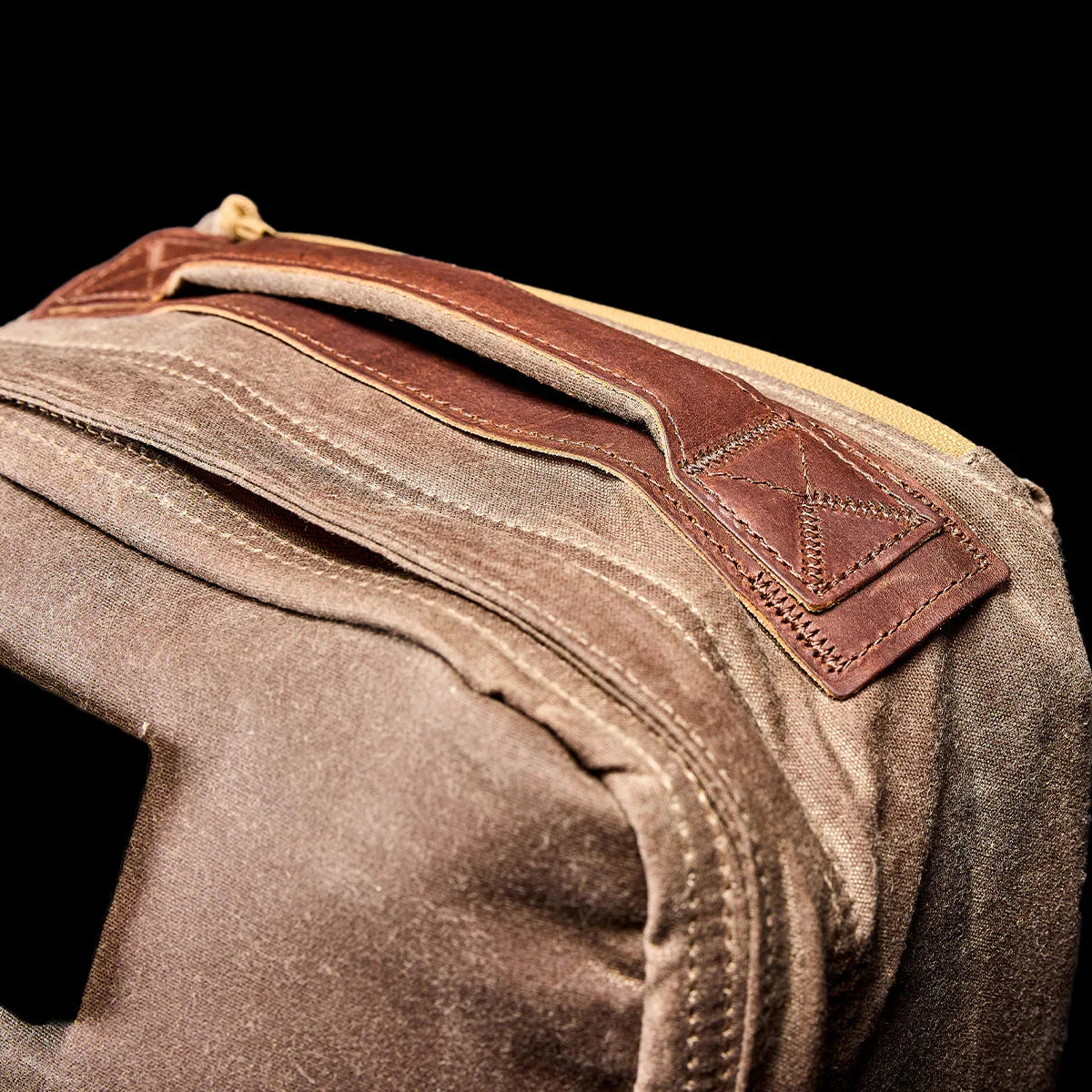 GORUCK Dark Oak rucksack detail with leather handle and rugged canvas fabric