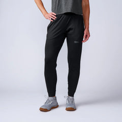 GORUCK black athletic joggers with logo, worn by model, studio background