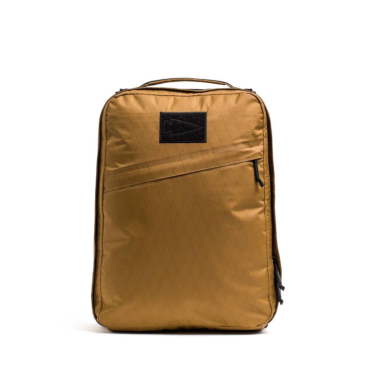 GORUCK rucksack in coyote brown color, durable XPAC fabric, front zipper pocket, arrowhead patch