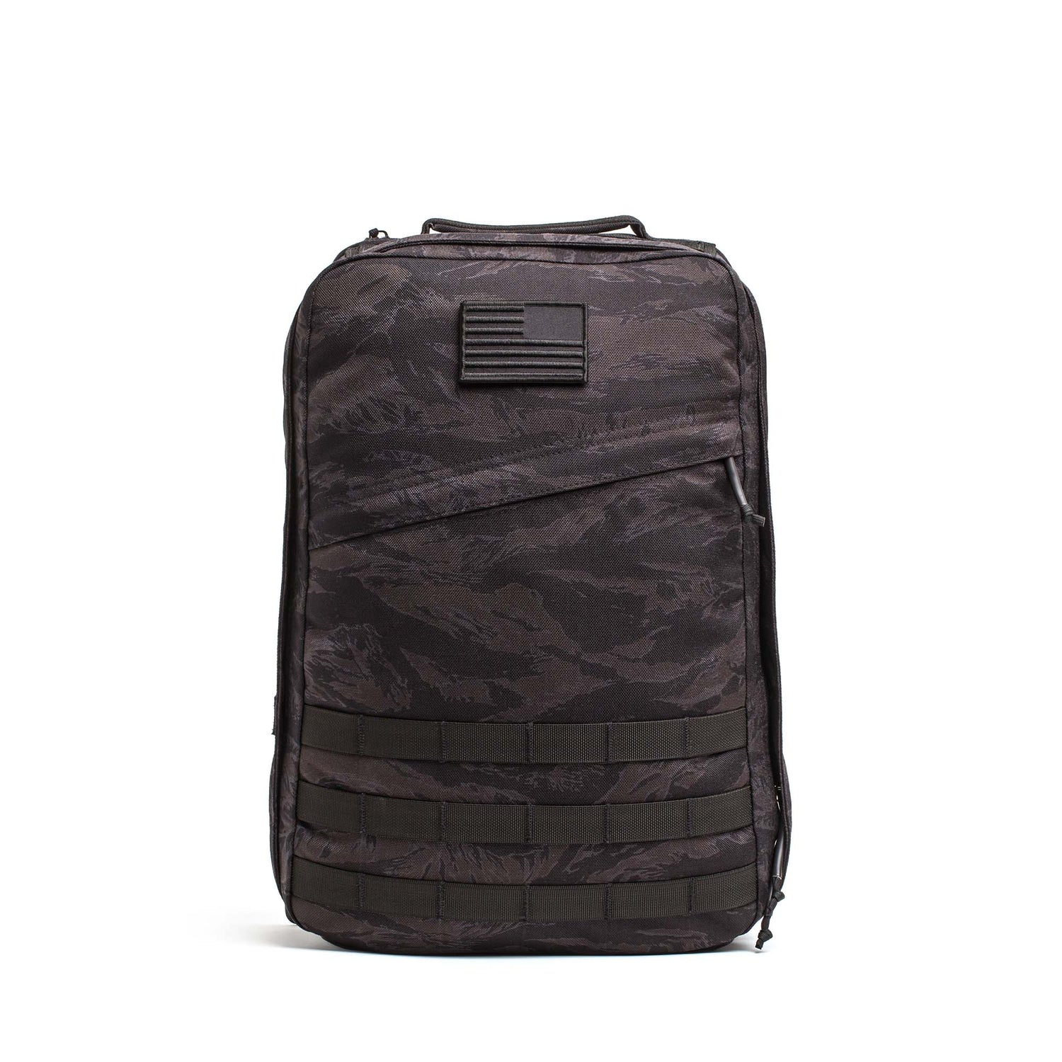 The GR1 USA – Cordura is a black camo everyday rucksack with an American flag patch and multiple lower front straps, built to Special Forces grade standards.