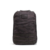 The GR1 USA – Cordura is a black camo everyday rucksack with an American flag patch and multiple lower front straps, built to Special Forces grade standards.