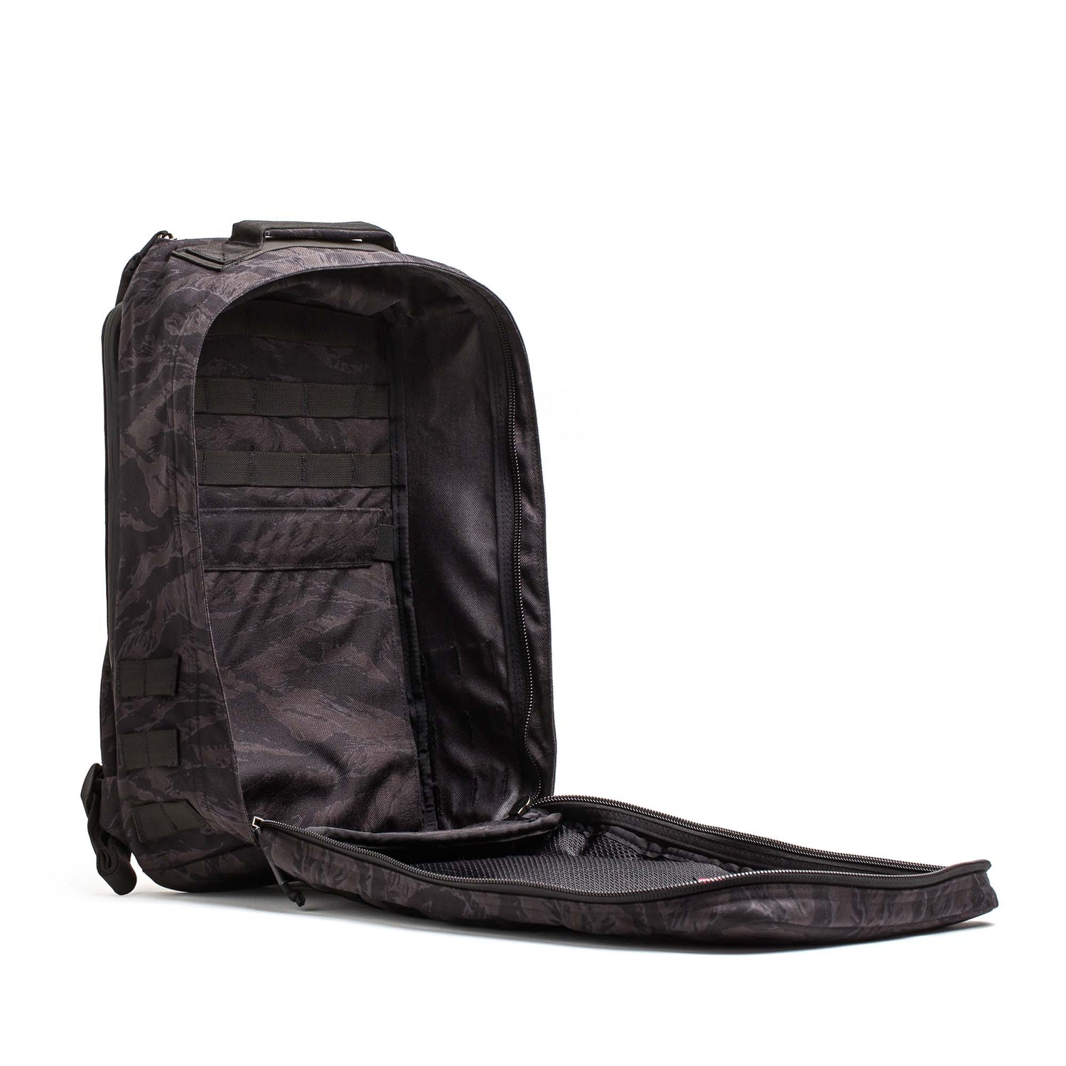 The GR1 USA - Cordura is a black, camouflage-patterned everyday carry rucksack with a spacious interior and mesh pocket, designed to Special Forces standards for unmatched reliability.