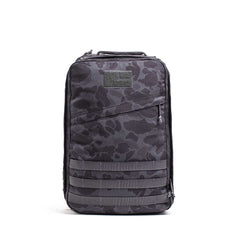 The GR1 rucksack in black and gray camouflage, featuring a front zipper and MOLLE webbing, is built to Special Forces grade standards and displayed upright on a white background.
