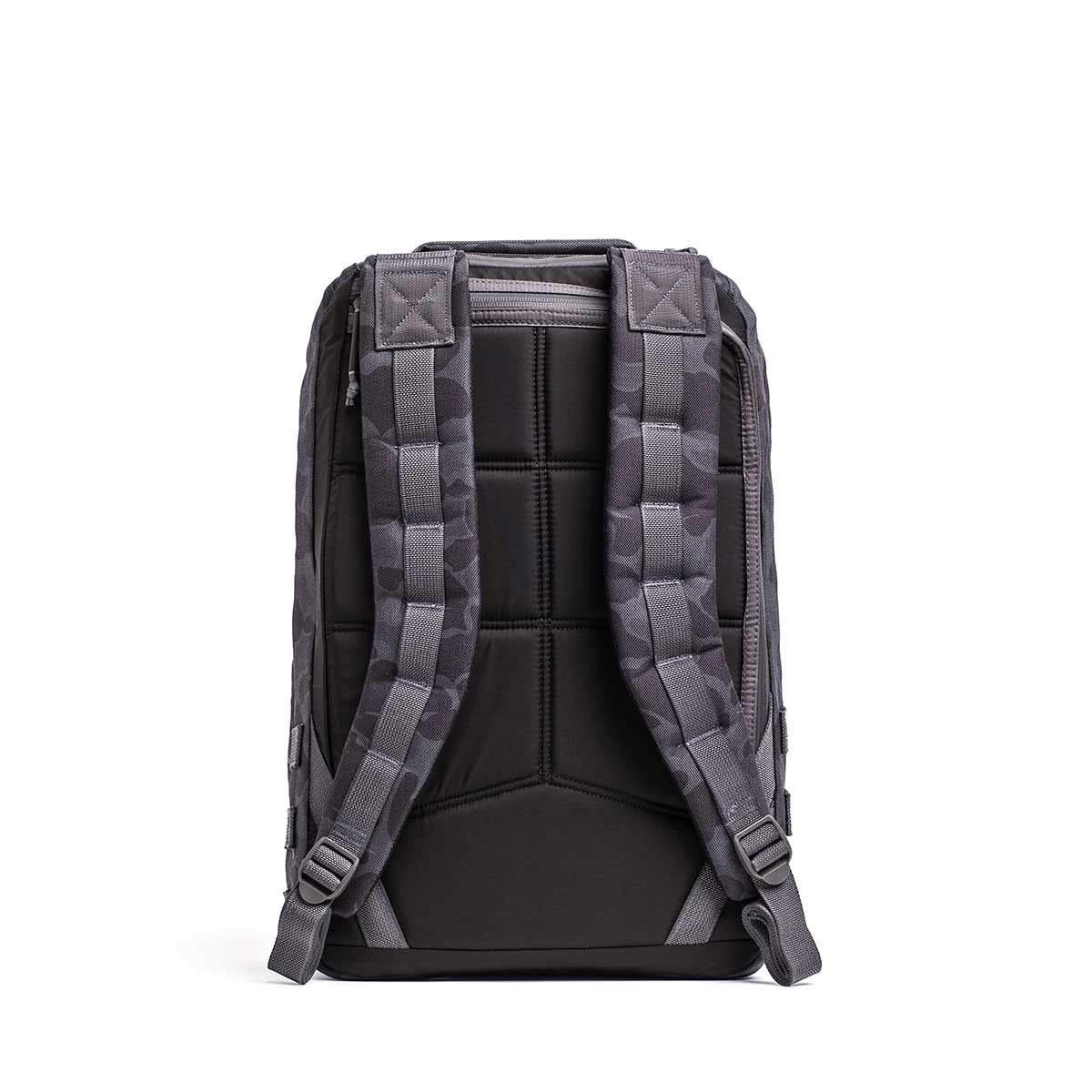 The GR1 rucksack, shown from the back in gray and black, features padded shoulder straps and a quilted back panel for comfort, inspired by Special Forces grade durability.