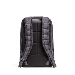 The GR1 rucksack, shown from the back in gray and black, features padded shoulder straps and a quilted back panel for comfort, inspired by Special Forces grade durability.