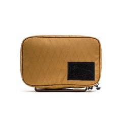 GORUCK Field Pocket XPAC Slick Coyote, tan rugged pouch with black patch, isolated on white