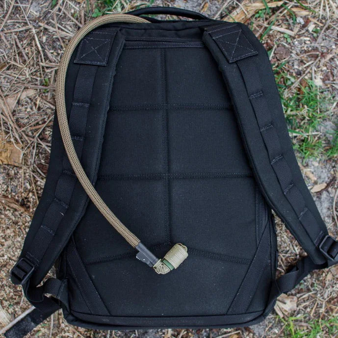 GORUCK black rucksack backpack with hydration tube on outdoor ground