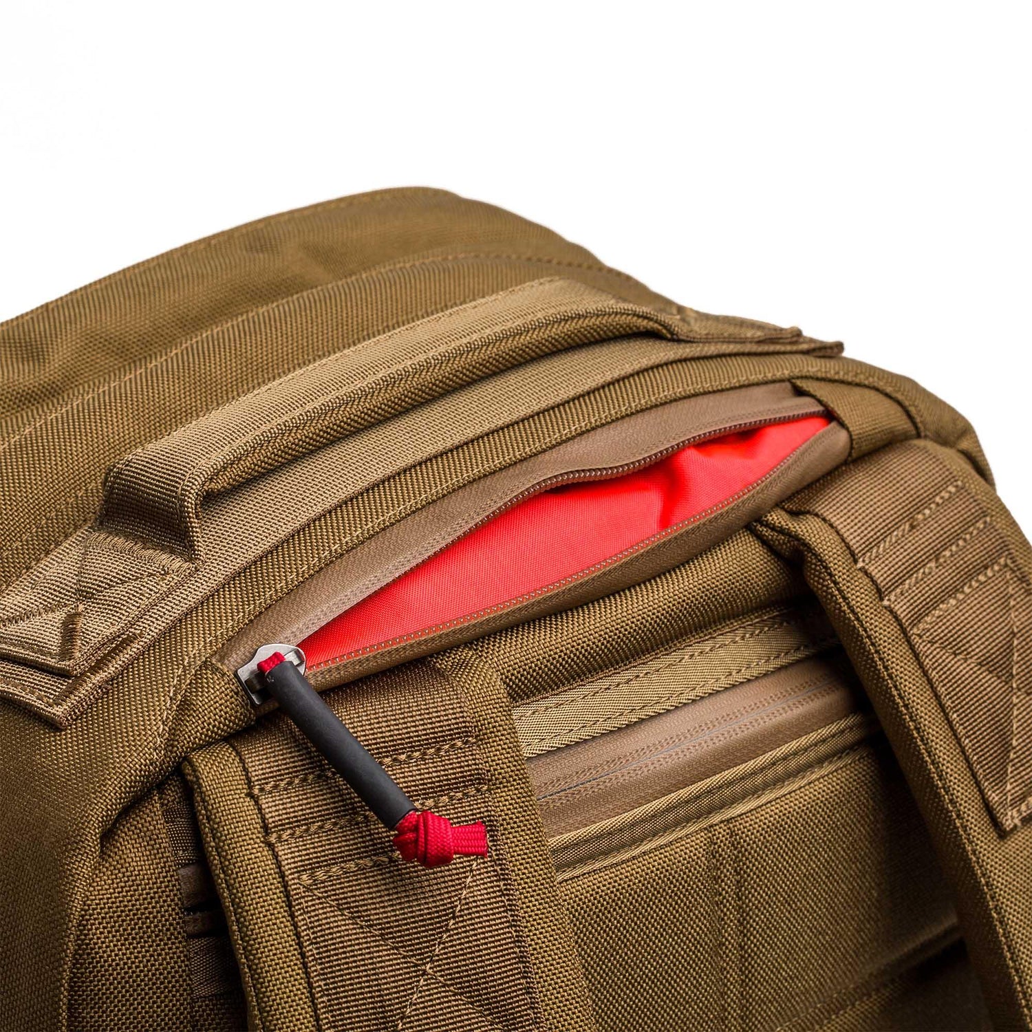 GORUCK coyote brown 26L rucksack detail with red-lined top zip pocket