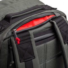 GORUCK grey and black tactical backpack with red interior and rugged shoulder straps