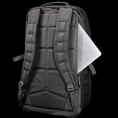 GORUCK black rucksack with padded straps and a laptop partially in back pocket