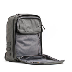 The GR2 - Cordura backpack in gray is shown with its front compartment unzipped, revealing a mesh inner pocket, all set against a white background.