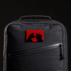 GORUCK black rucksack with red samurai patch, durable rucking gear close-up