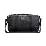 GORUCK black duffel gym bag with shoulder strap, durable rucking gear on white background