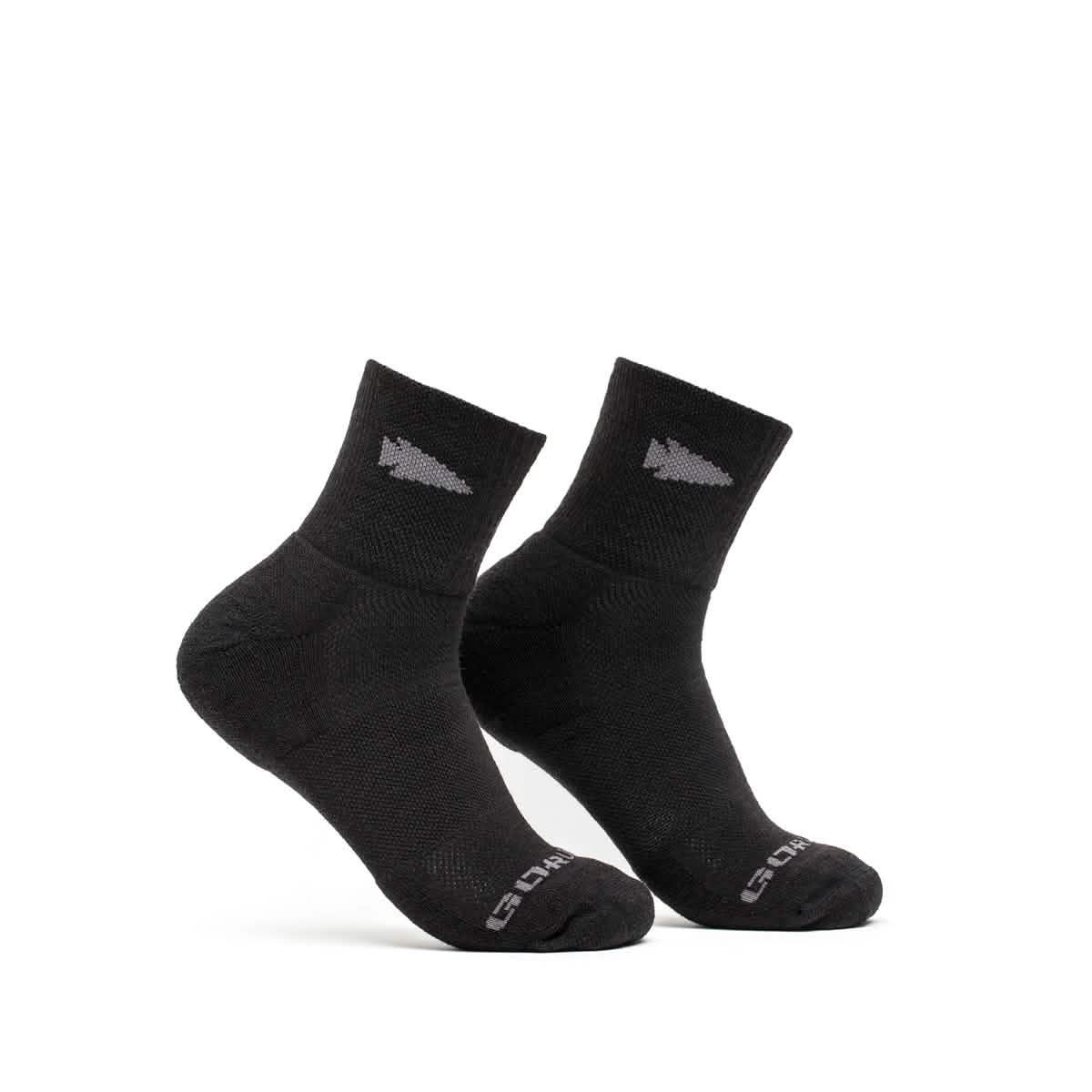 GORUCK black Merino wool trail cuff socks with arrow pattern on ankle, white background
