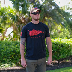 Man wearing GORUCK Join or Die t-shirt outdoors, black shirt with red snake design