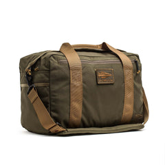 The Kit Bag (Includes Shoulder Strap) features an olive green design with tan straps, a front zipper pocket, and a GORUCK logo patch—a modern update on the classic Special Forces flight bag.