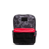 GORUCK black camo backpack with red front pocket and black patch on white background