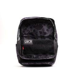GORUCK KR1 backpack in black camo pattern with open main compartment and visible interior label