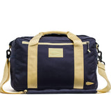 GORUCK navy and gold Lead Kit Bag with arrowhead patch and tan straps