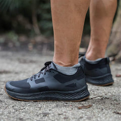 GORUCK charcoal low-cut merino socks worn with black running shoes outdoors