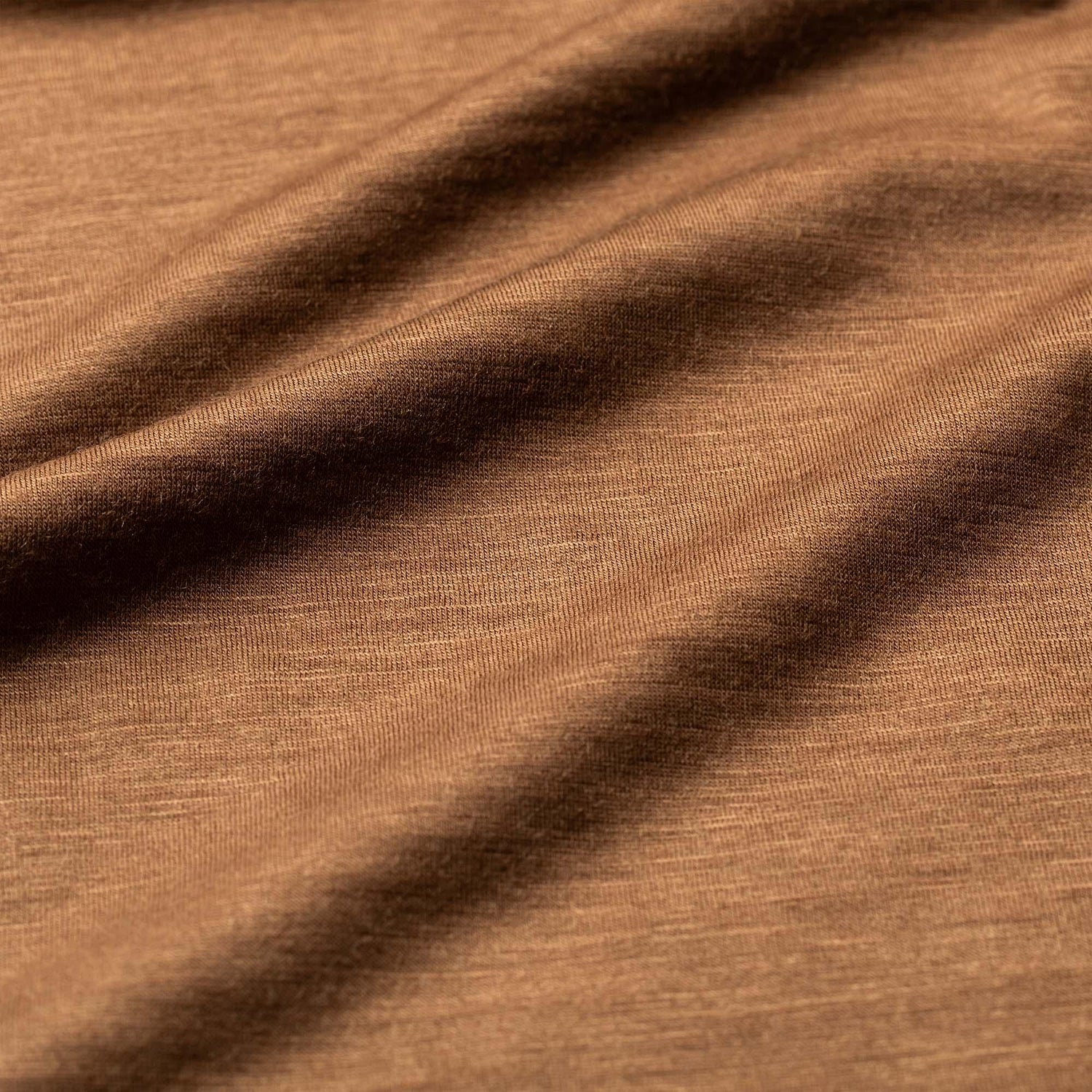 Close-up of brown Merino wool fabric for GORUCK Polo shirt, showcasing soft texture