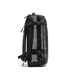 GORUCK black mesh rucking backpack with compression straps, side view on white background