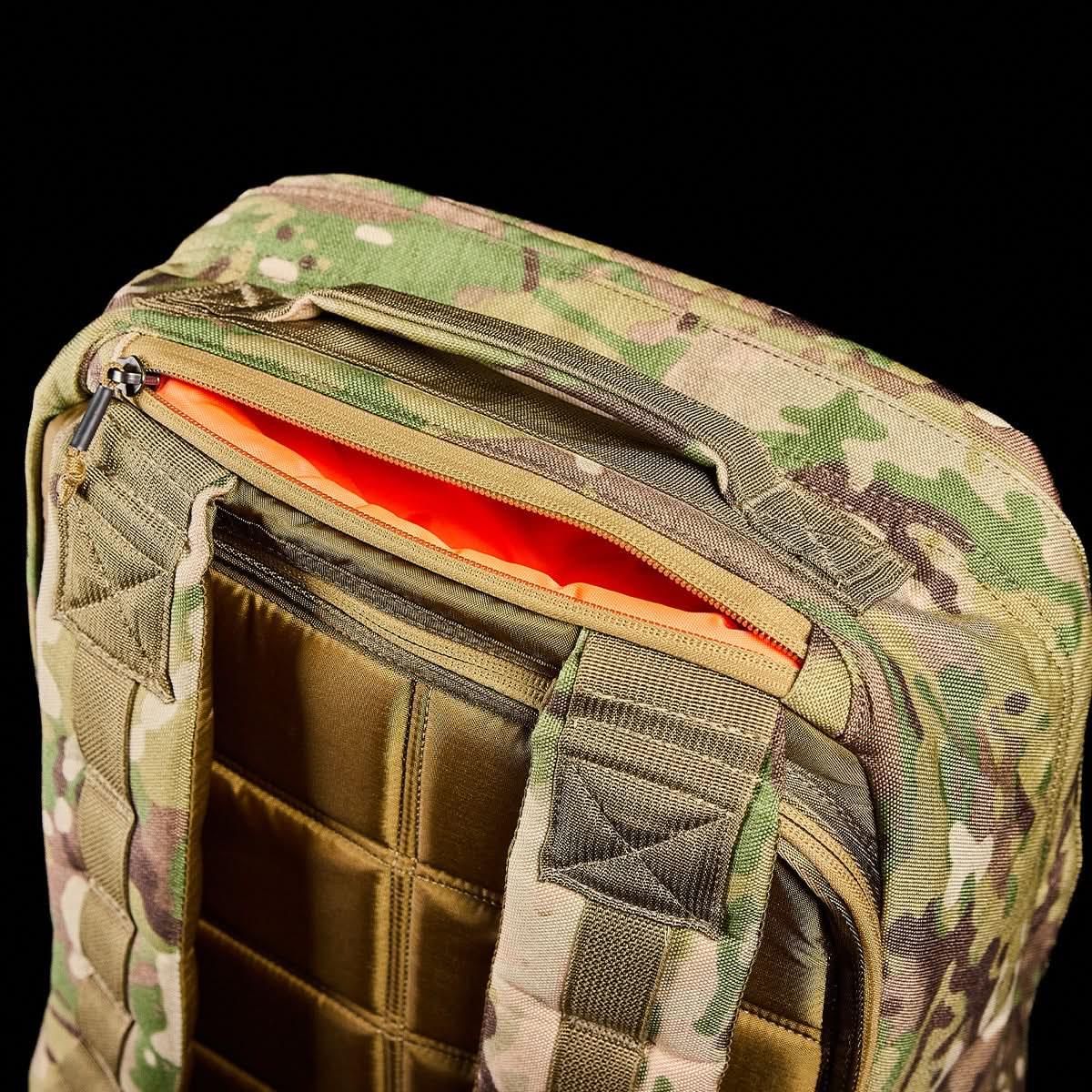 GORUCK Multicam tactical backpack close-up with open zipper and padded straps