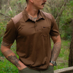 Man wearing GORUCK brown tactical polo shirt outdoors, showing rugged hiking and rucking style