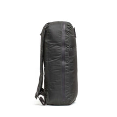 Side view of the Packable Bullet Ruck - Ripstop ROBIC® backpack in dark gray, featuring AquaGuard zippers and padded shoulder straps, standing upright.