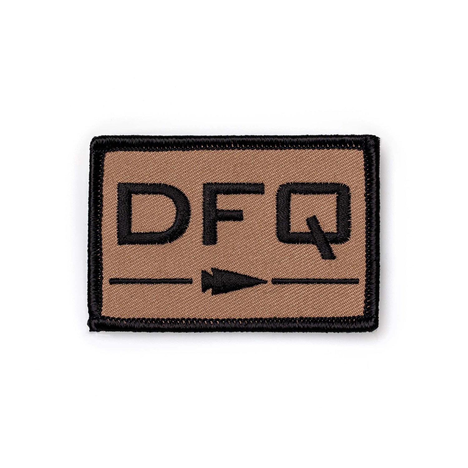 GORUCK DFQ patch in tan with black lettering and arrow, durable rucking gear accessory