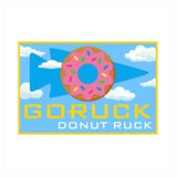 GORUCK Donut Ruck patch with pink sprinkled donut, blue arrowhead, clouds, yellow border