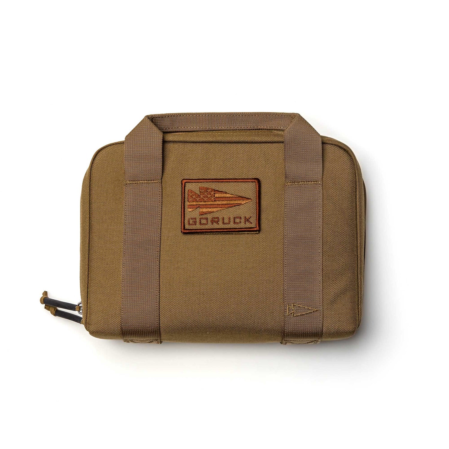 A tan GORUCK Pistol Rug made from rugged 1000D Cordura, featuring sturdy handles and a jet logo patch on the front.
