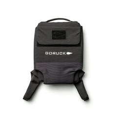 The RPC 3.0 + 10lb Ruck Sandplate is a black backpack with a top handle, front flap, and white logo, designed for weighted training and shown on a white background.