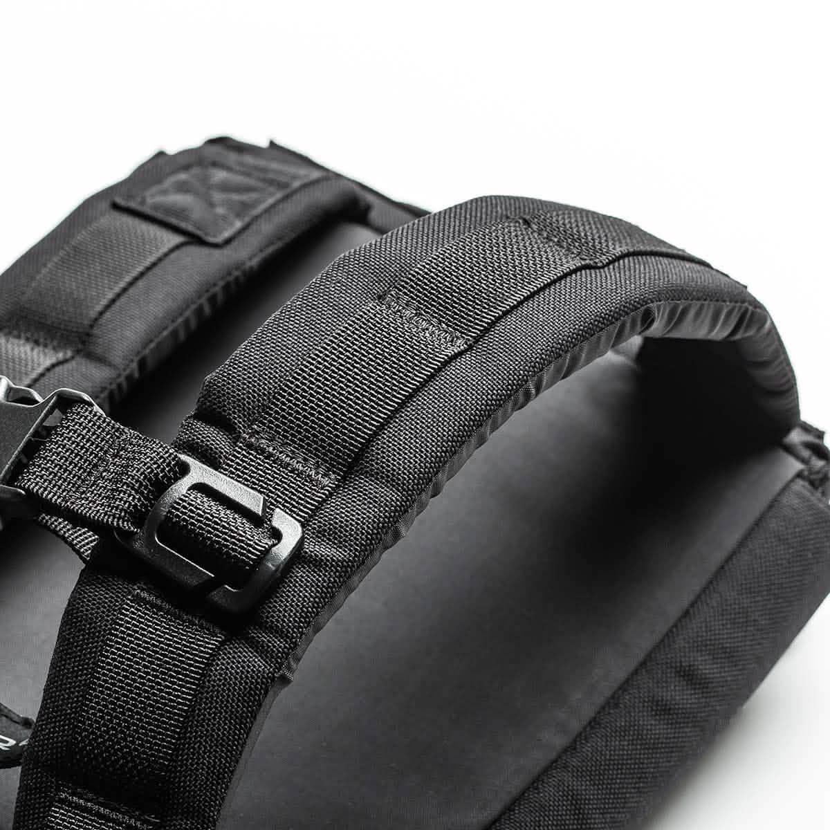 Close-up of GORUCK black rucksack shoulder straps with heavy-duty webbing and buckle