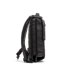Side view of GORUCK black tactical rucksack with padded straps on white background