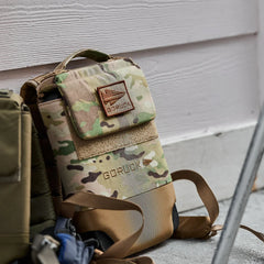 GORUCK Ruck Plate Carrier 3.0 in multicam pattern resting against wall outdoors