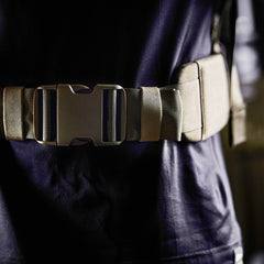 Close-up of a person wearing the Padded Hip Belt in tan with a large buckle over a dark shirt—designed for comfort and support during rucking.