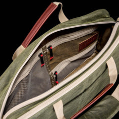 GORUCK olive waxed canvas shoulder bag 15L, tan handles, open with mesh pockets visible