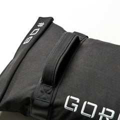 The Simple Training Sandbags feature a black design with a handle and white stitched "09" and "GOP" text—ideal for home gym workouts.