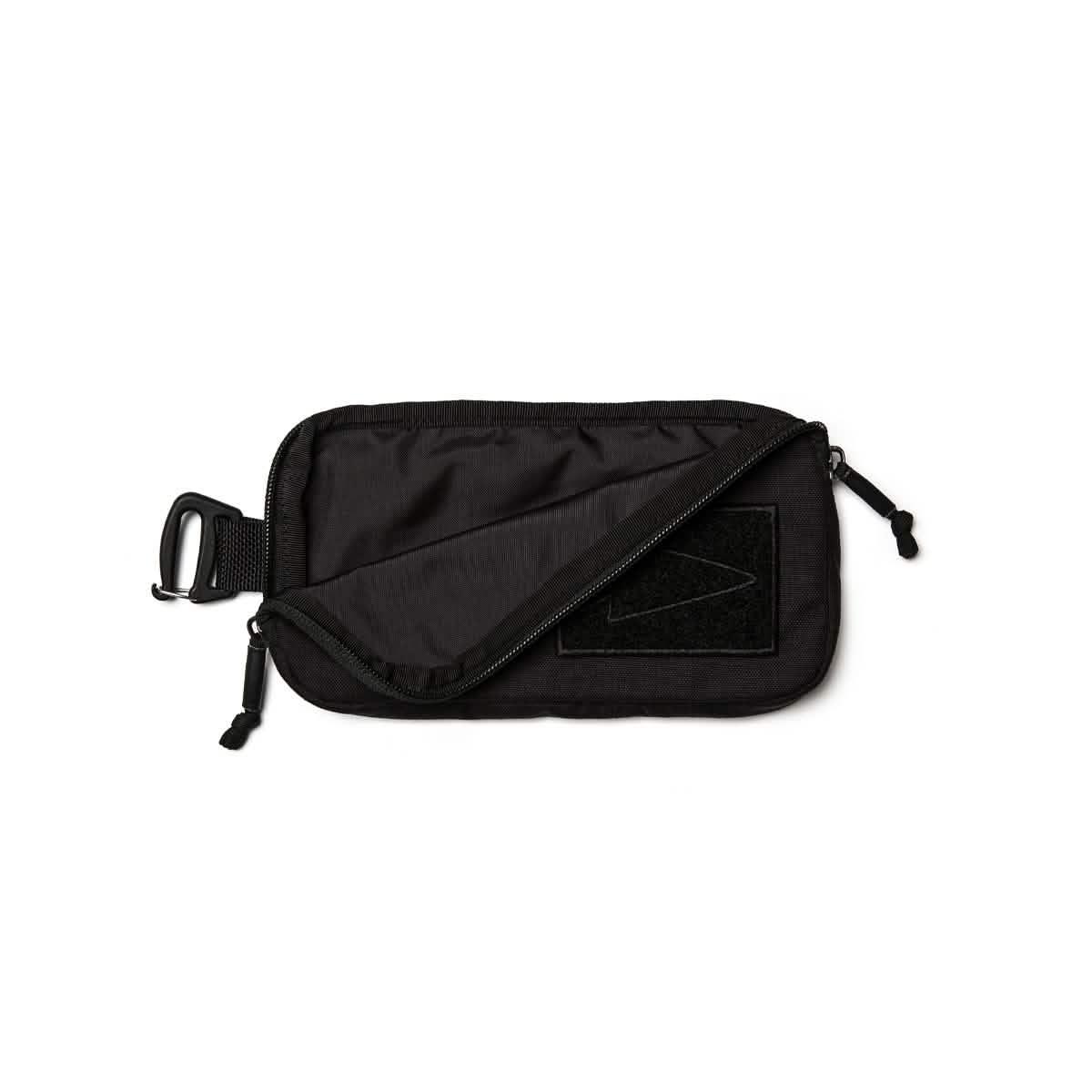 GORUCK black sternum strap pouch with zipper and attachment clip on white background