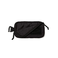 GORUCK black sternum strap pouch with zipper and attachment clip on white background