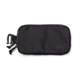 The Sternum Pouch - X-PAC is a black pouch featuring a carabiner clip, dual zipper pulls, and an arrow logo on the bottom right corner.