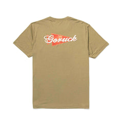 The GORUCK Bud Tee - Tri-Blend is a khaki premium shirt with a red and white "Goruck" logo on the upper back, ideal for everyday wear.