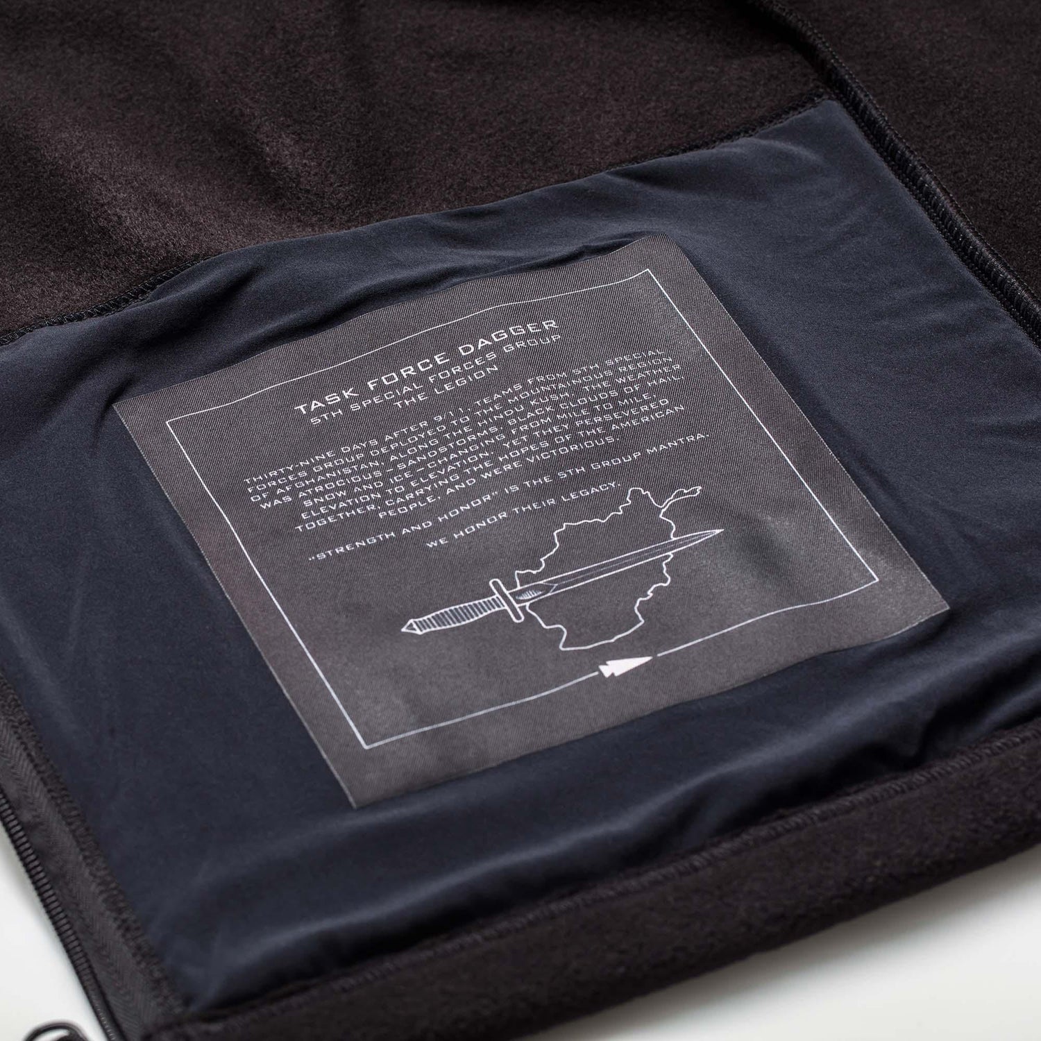 GORUCK Task Force Dagger fleece jacket interior patch with special forces graphic and text