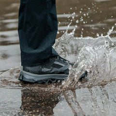 GORUCK Trail Merino Sock Charcoal in black shoe splashing through water outdoors