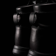 Close-up of black GORUCK rucking boots with rugged leather design and reinforced stitching.